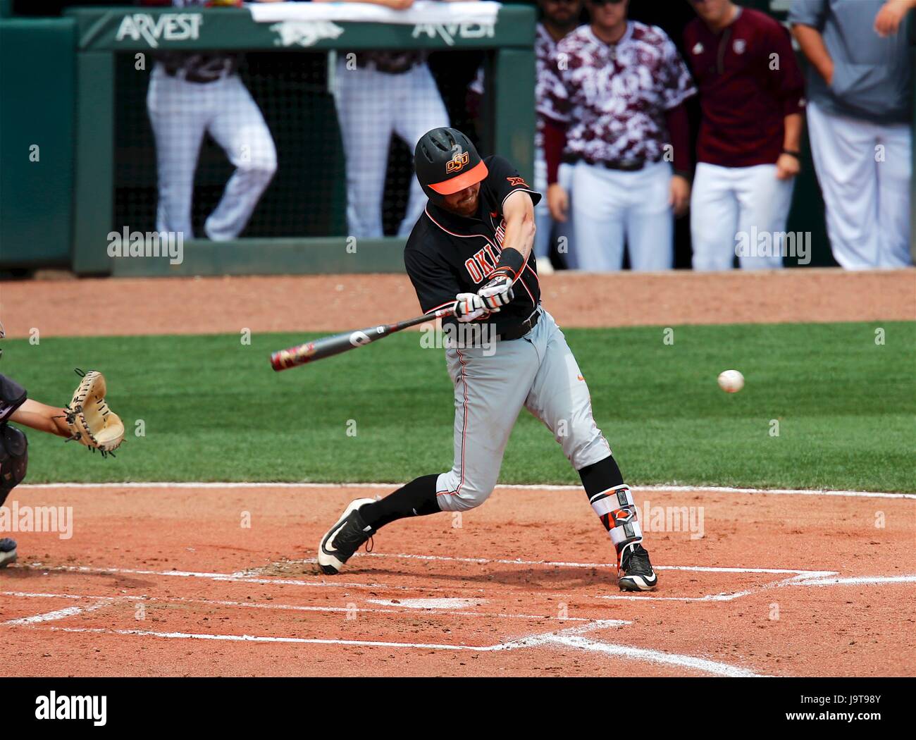 Play. 2nd June, 2017. Cowboys third baseman Michael Neustifter #15 puts a ball in play. The Missouri State Bears defeated the Oklahoma State Cowboys 6-5 at Baum Stadium in Fayetteville, AR, Richey Miller/CSM/Alamy Live News Stock Photo
