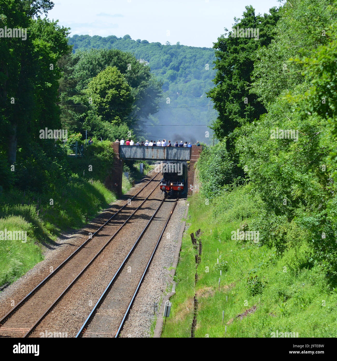 Reigate, Surrey, UK. 3rd June, 2017. Crowds wait in anticipation to see the Flying Scotsman 60103 Cathedrals Express Steam Locomotive hauling pullman coaches as it speeds through Reigate in Surrey. 1304hrs Saturday 3rd June 2017. Photo ©Lindsay Constable / Alamy Live News Stock Photo