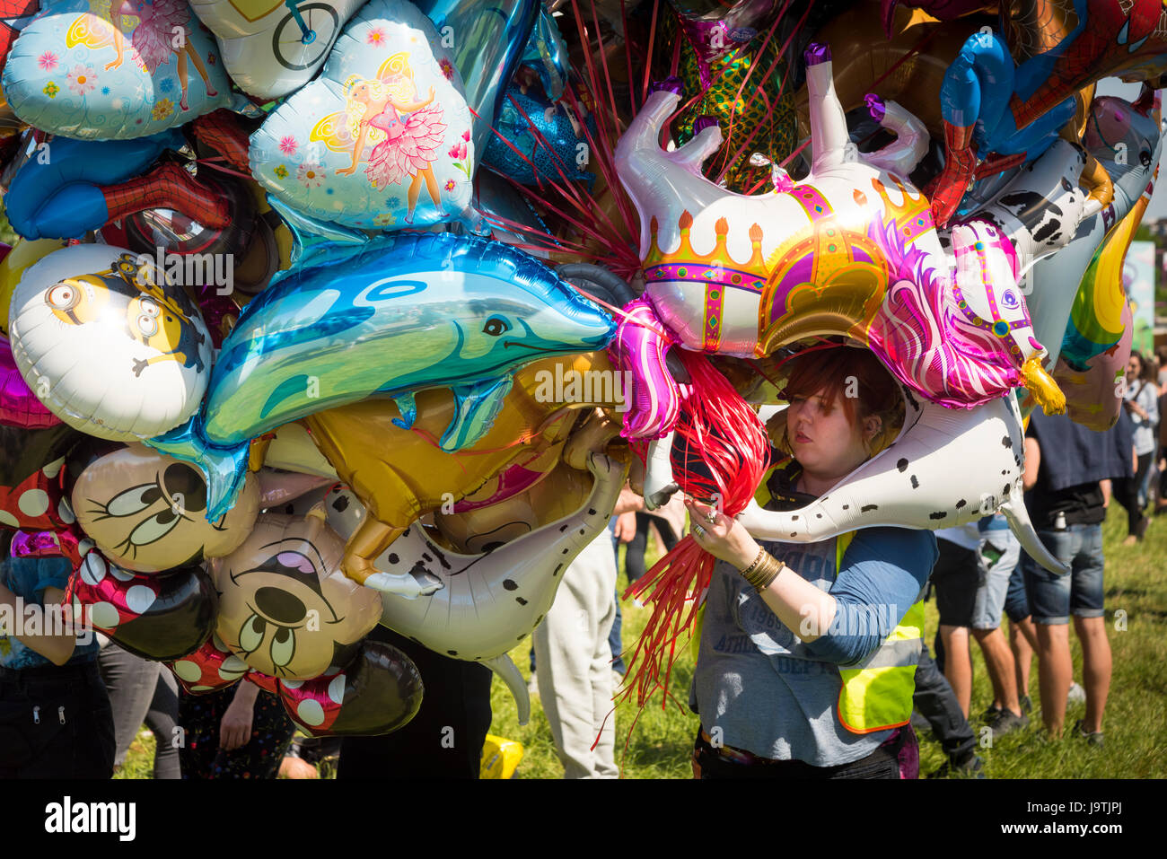 Cambridge, UK. 3rd June, 2017. Revellers enjoy themselves in the sun at the annual Strawberry Fair held on Midsummer Common. Billed as a musical and visual extravanganza for all the family, it is a free music and arts event run by volunteers. Credit: Julian Eales/Alamy Live News Stock Photo