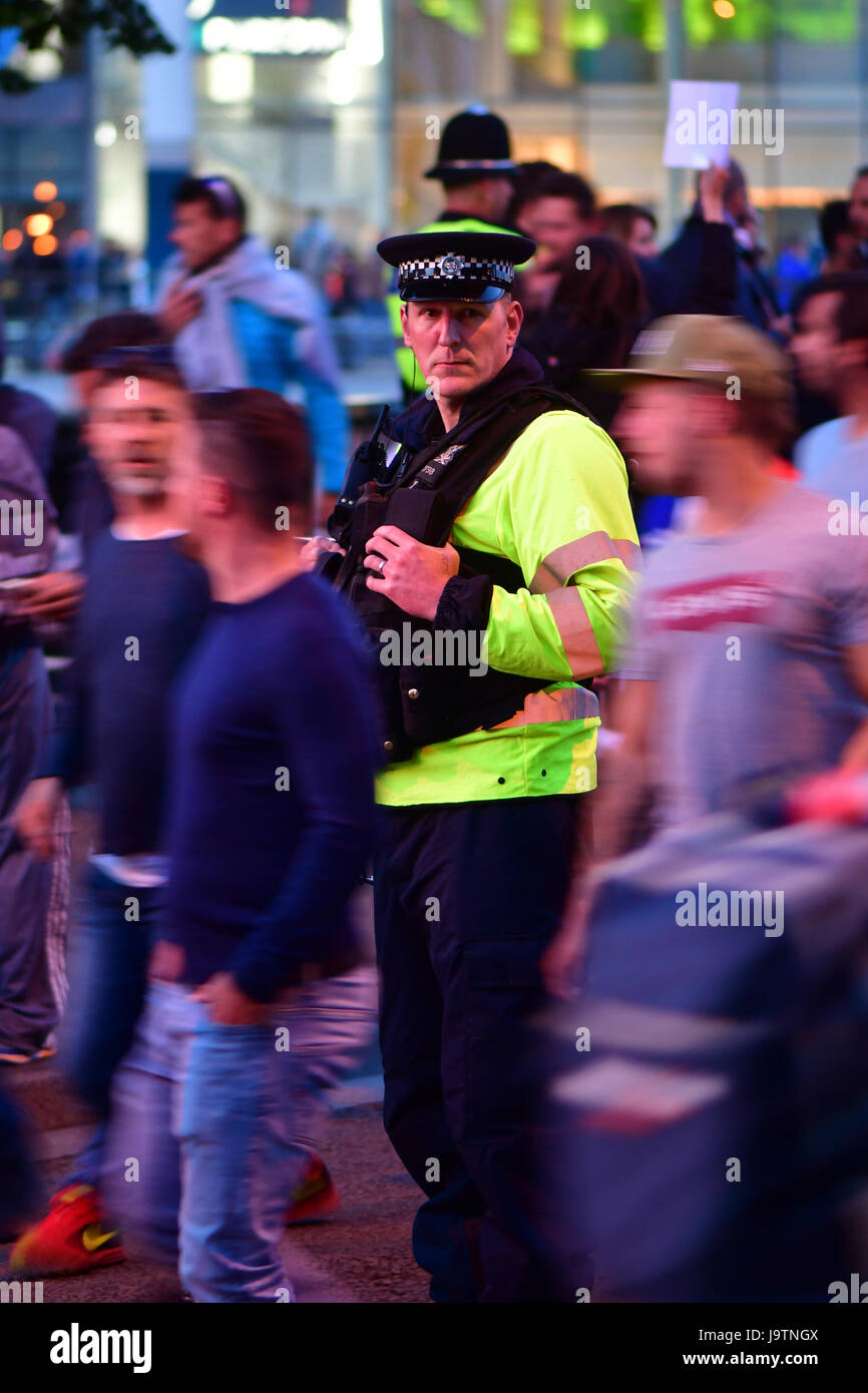 CARDIFF, UK. 3rd June, 2017. Policeman amongst fans during Champions League Final. British security services on high alert as hundreds of thousands of fans enjoy football in the capital of Wales Credit: Ian Redding/Alamy Live News Stock Photo
