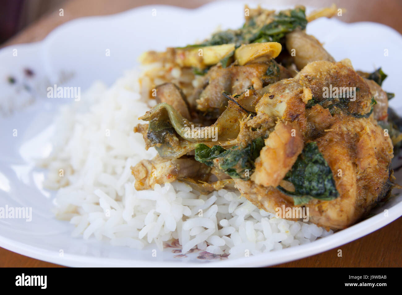 Deep fried grouper fish spicy with rice. Stock Photo
