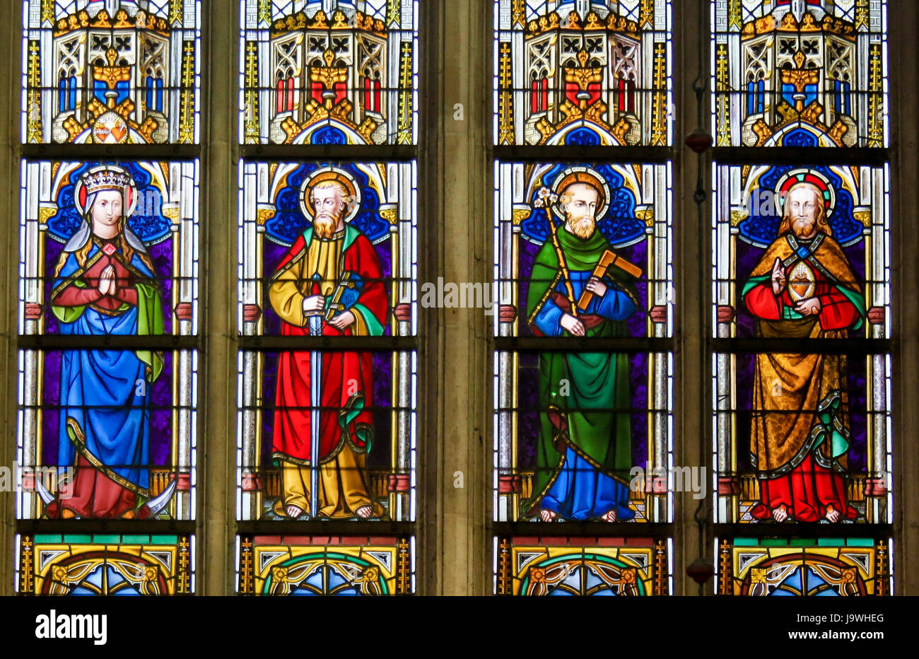 Stained Glass Window Depicting Catholic Saints In The Cathedral Of Saint Bavo In Ghent Flanders Belgium Including Jesus Saint Paul And Saint Josep Stock Photo Alamy