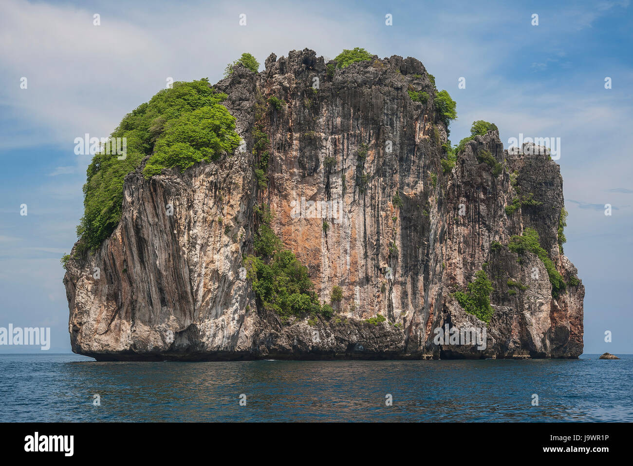 Limestone rock in the sea, Phuket, Thailand Stock Photo