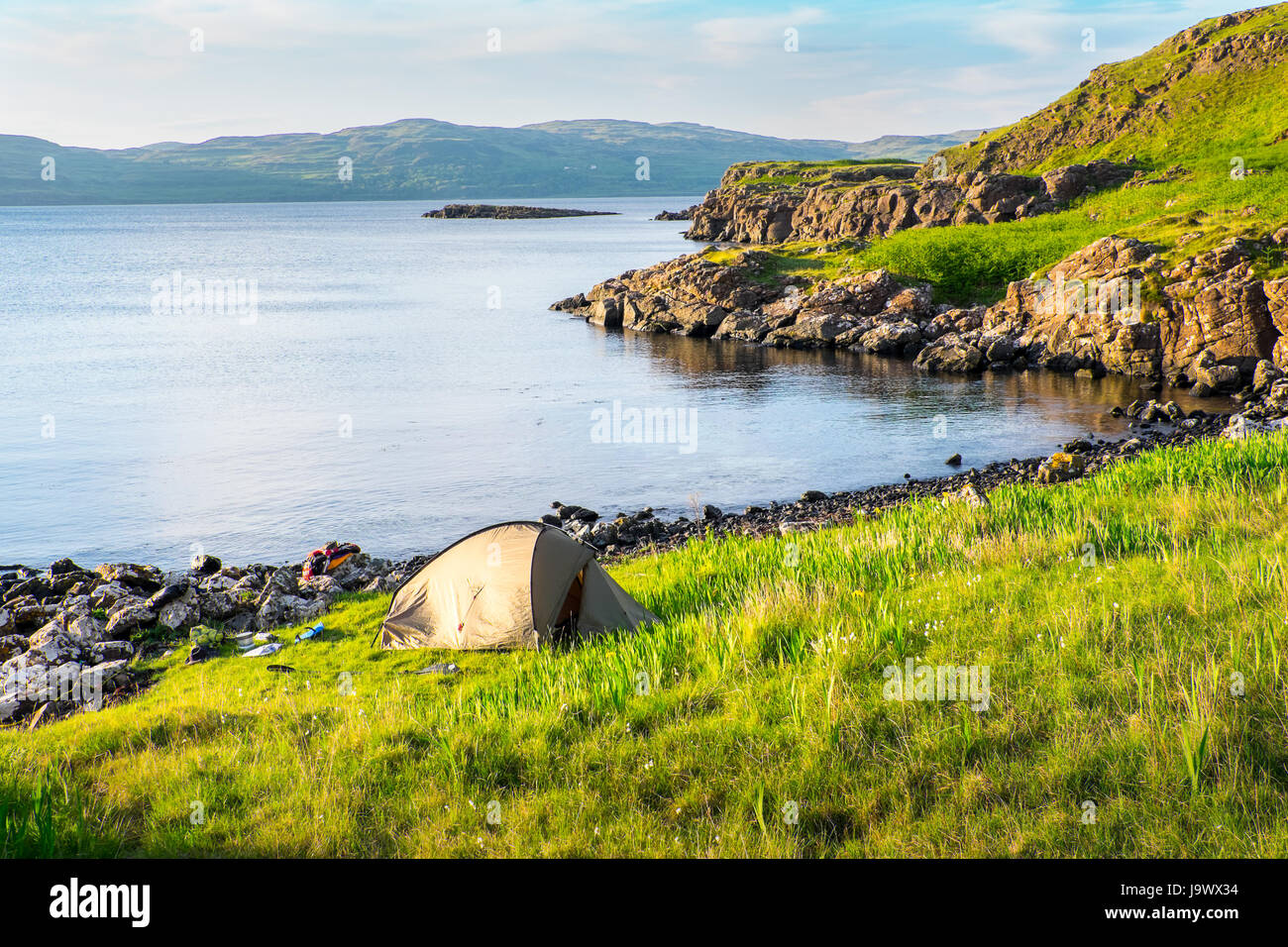 Wild camping whilst sea kayaking on the island of Ulva on the west coast of Mull in the Scottish Hebrides Stock Photo