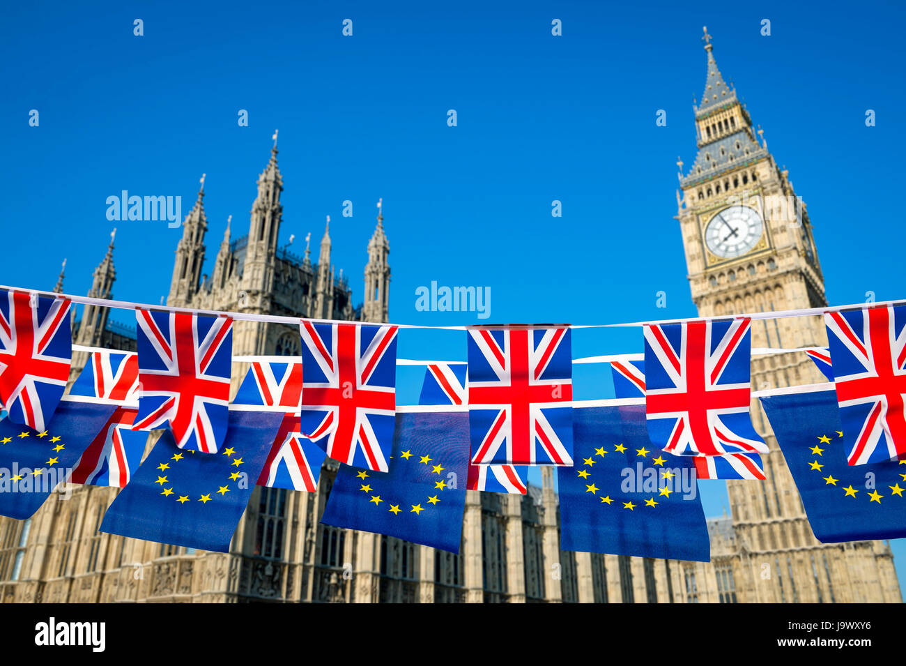 United Kingdom and European Union flag bunting flying together in a spirit of Brexit cooperation at the Houses of Parliament, Westminster, London Stock Photo
