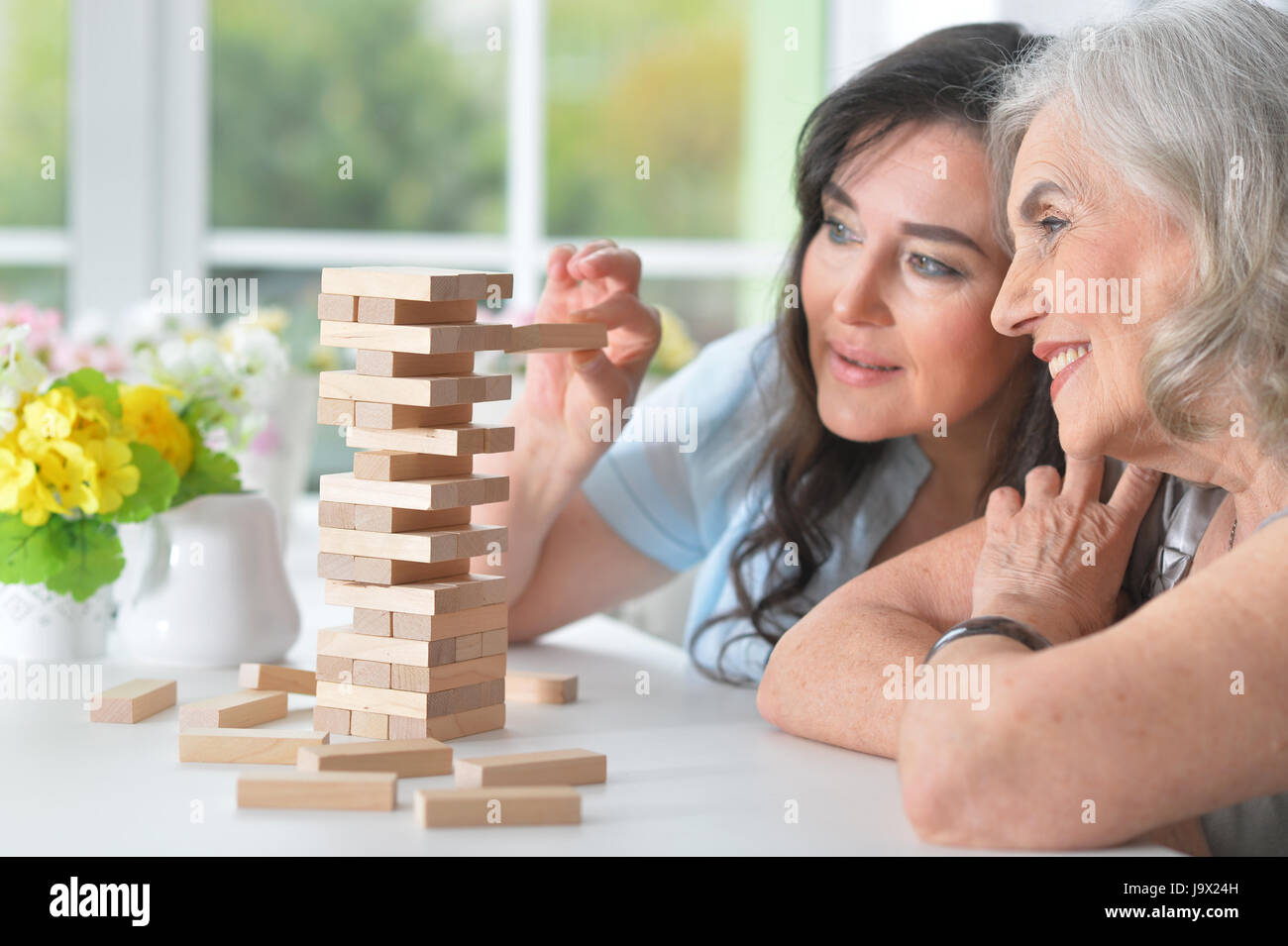 Old people play a board game Stock Photo