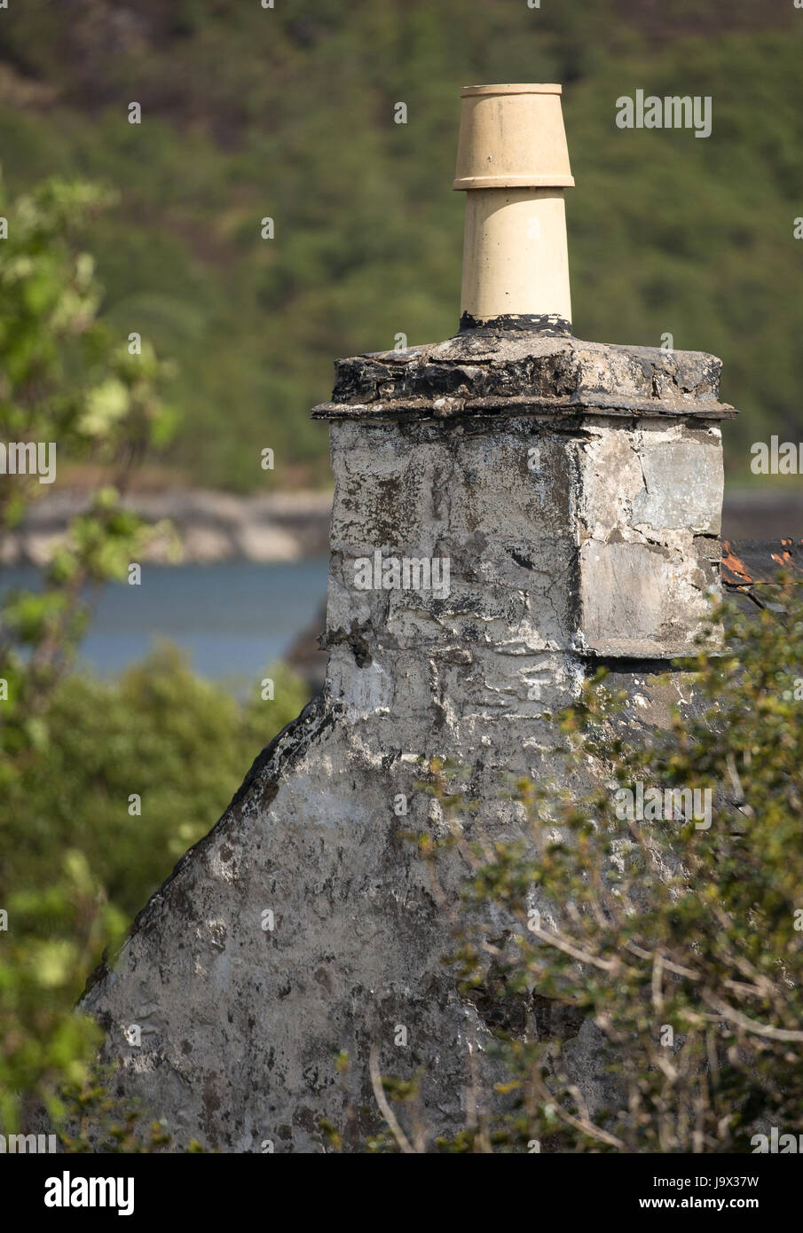 Chimney stack and chimney pot on an old ruined house on the west coast of Scotland Stock Photo