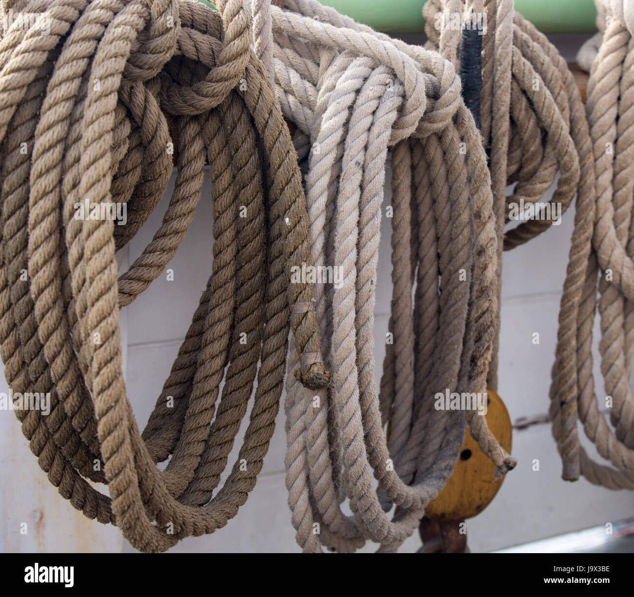 Coils of hemp rope forming part of the rigging on an old sailing ship Stock Photo