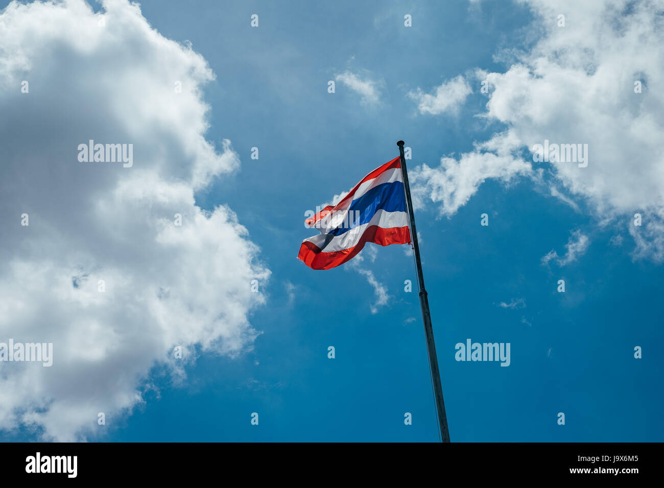 Thai flag pole with blue sky and cloud Stock Photo - Alamy
