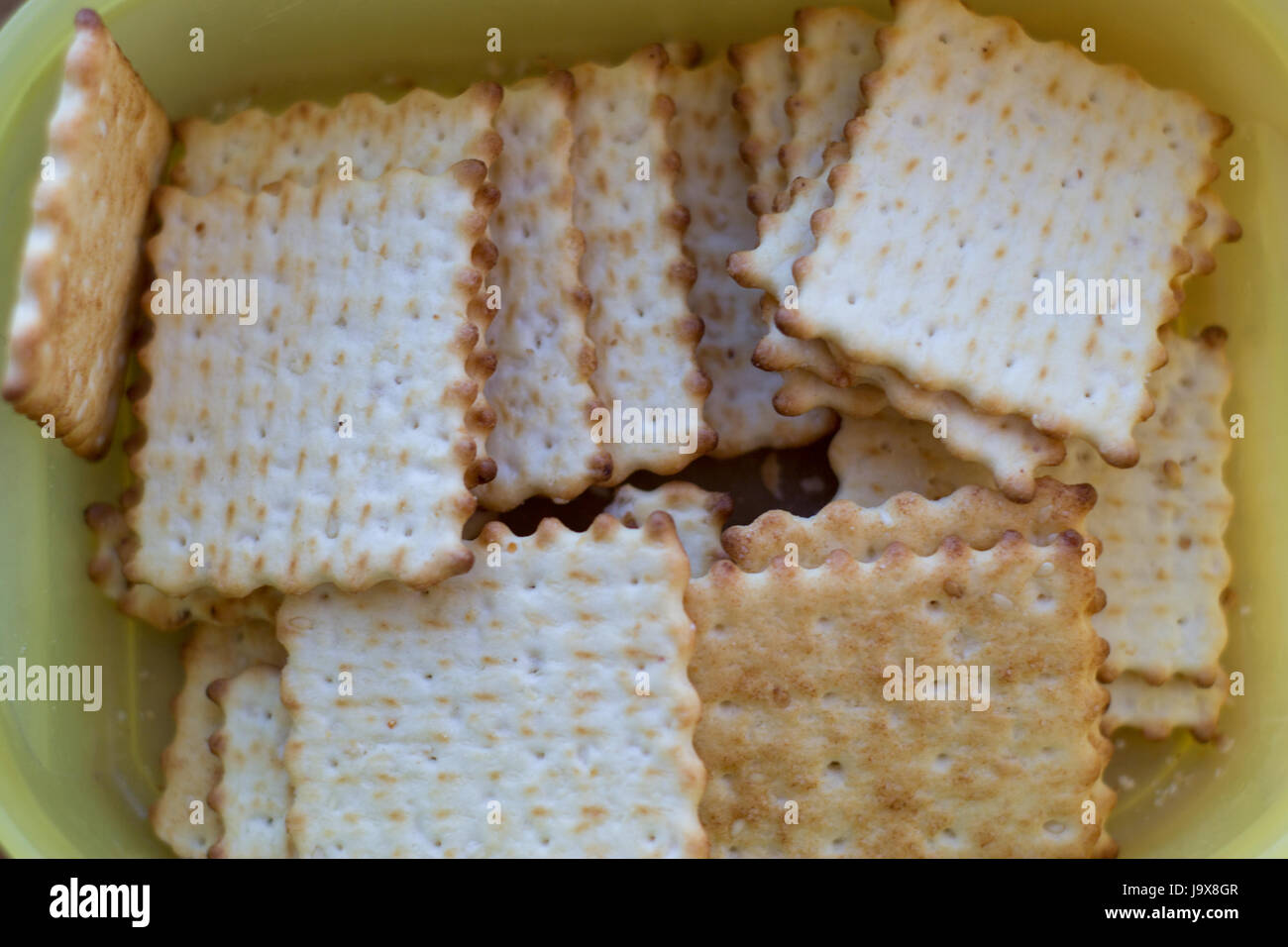 Many crackers lie in a yellow box Stock Photo Alamy