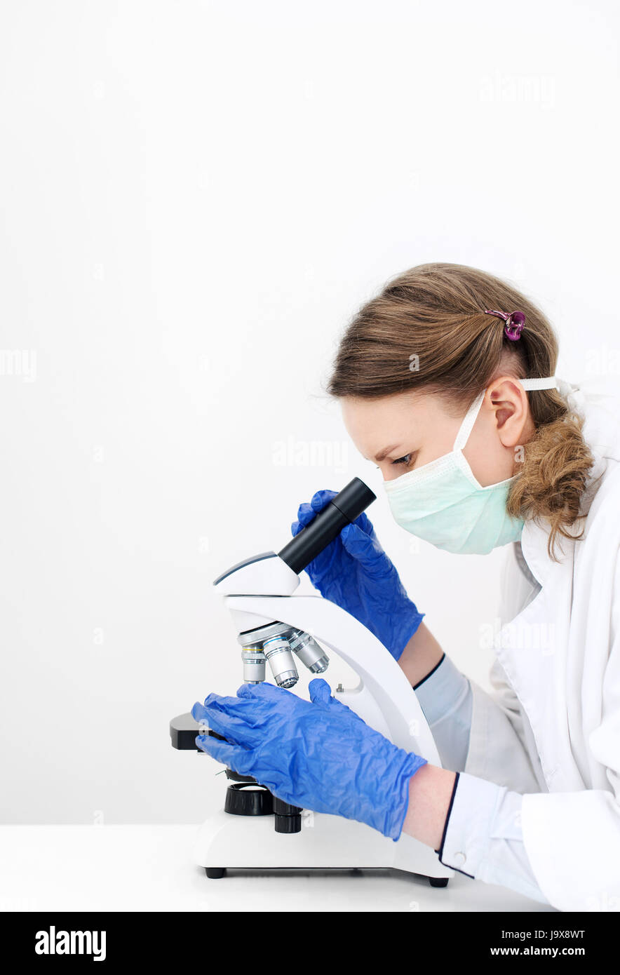 Doctor Using Microscope Imabe Doctor using microscope in laboratory. Space for text Stock Photo - Alamy