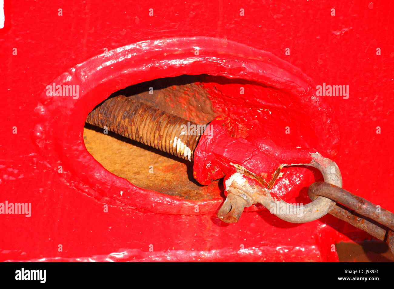 red ship wall with carbine and anchor cable Stock Photo