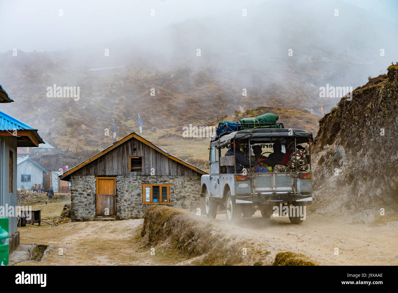 DARJEELING, INDIA - NOVEMBER 29, 2016: a tourist jeep passes through Singalila National Park.  It is the route to Sankakphu and Phalut, the two highes Stock Photo
