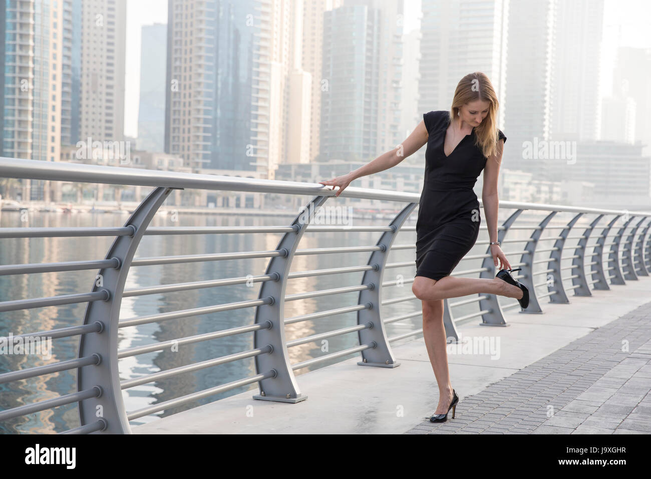 Businesswoman in a formalwear in Dubai Marina Stock Photo