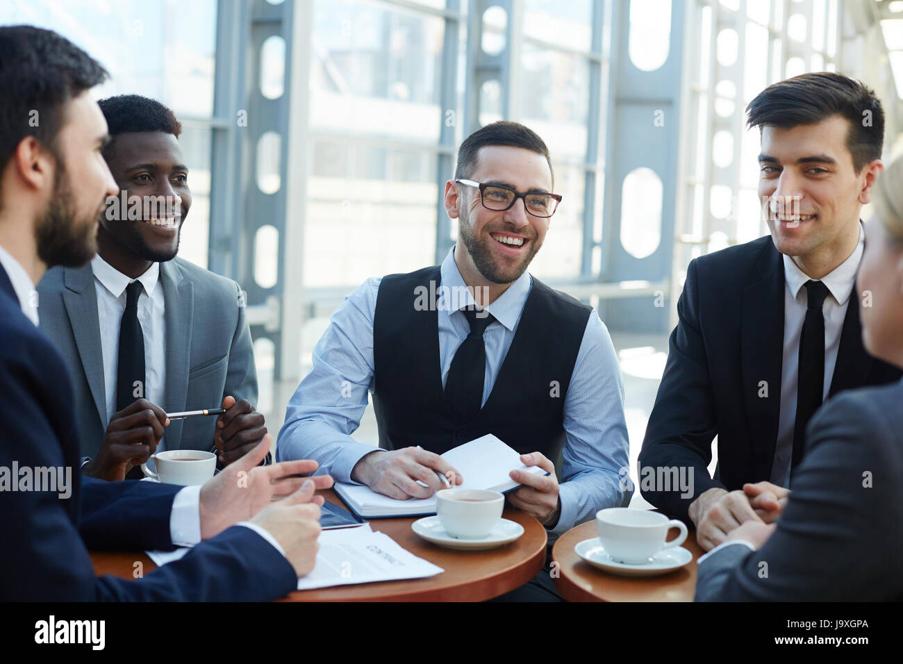 Happy team having meeting hi-res stock photography and images - Alamy