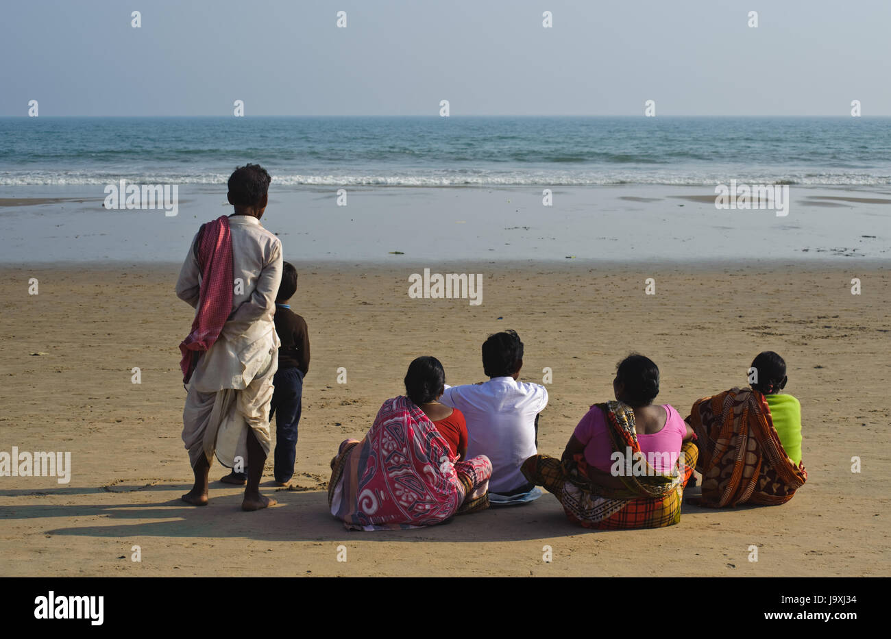 Indian tourists are gazing at the sea ( i.e. the Bay of Bengal) ( India) Stock Photo