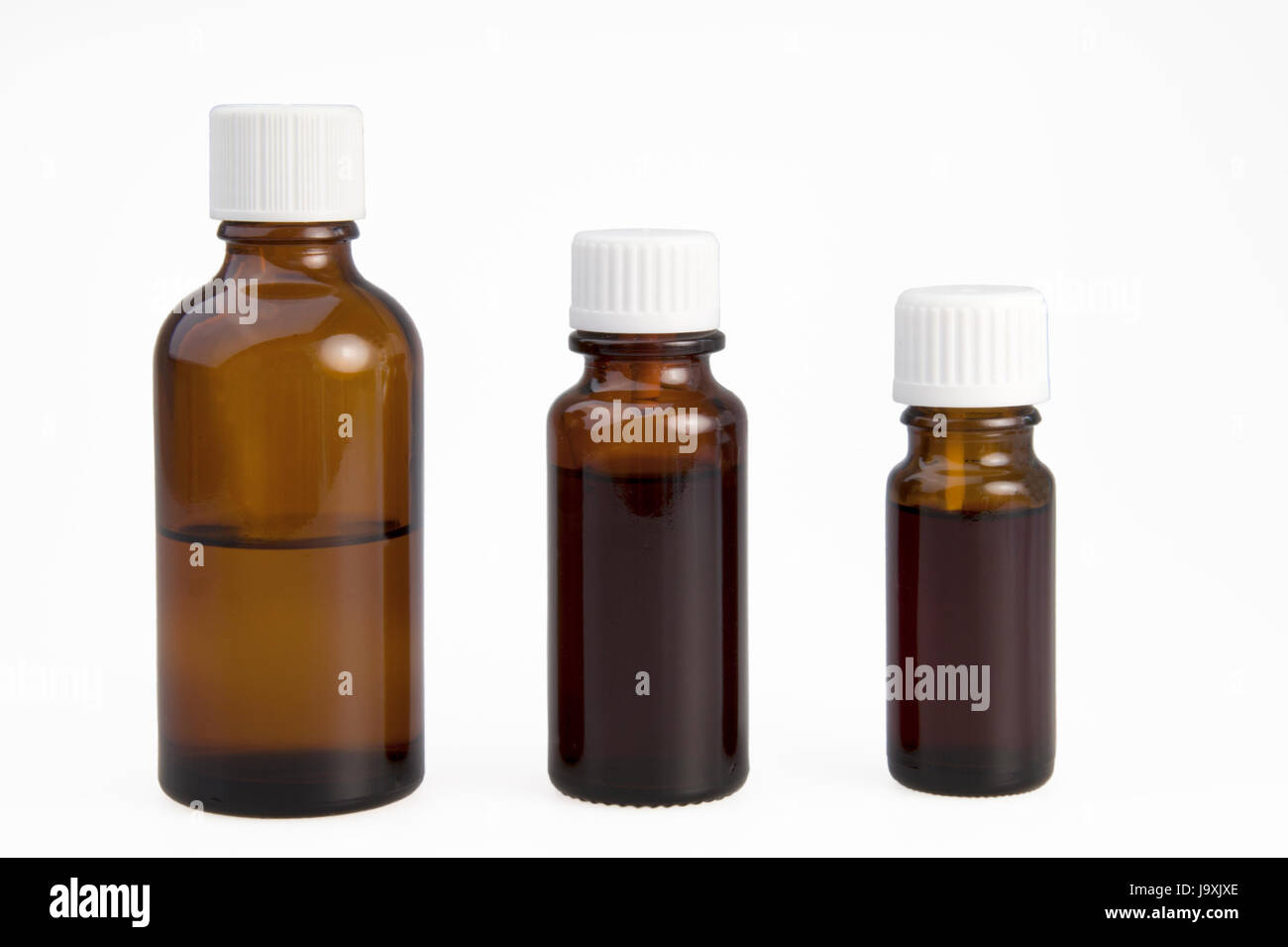 three brown medicine bottles Stock Photo Alamy