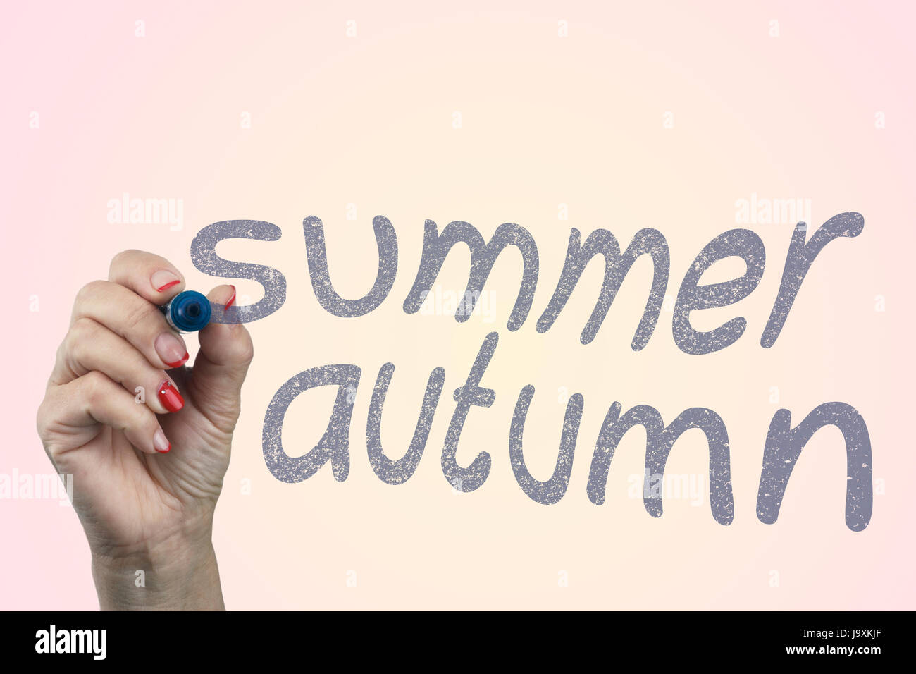 Hand Writing Summer Autumn With Blue Marker Concept Stock Photo - Alamy