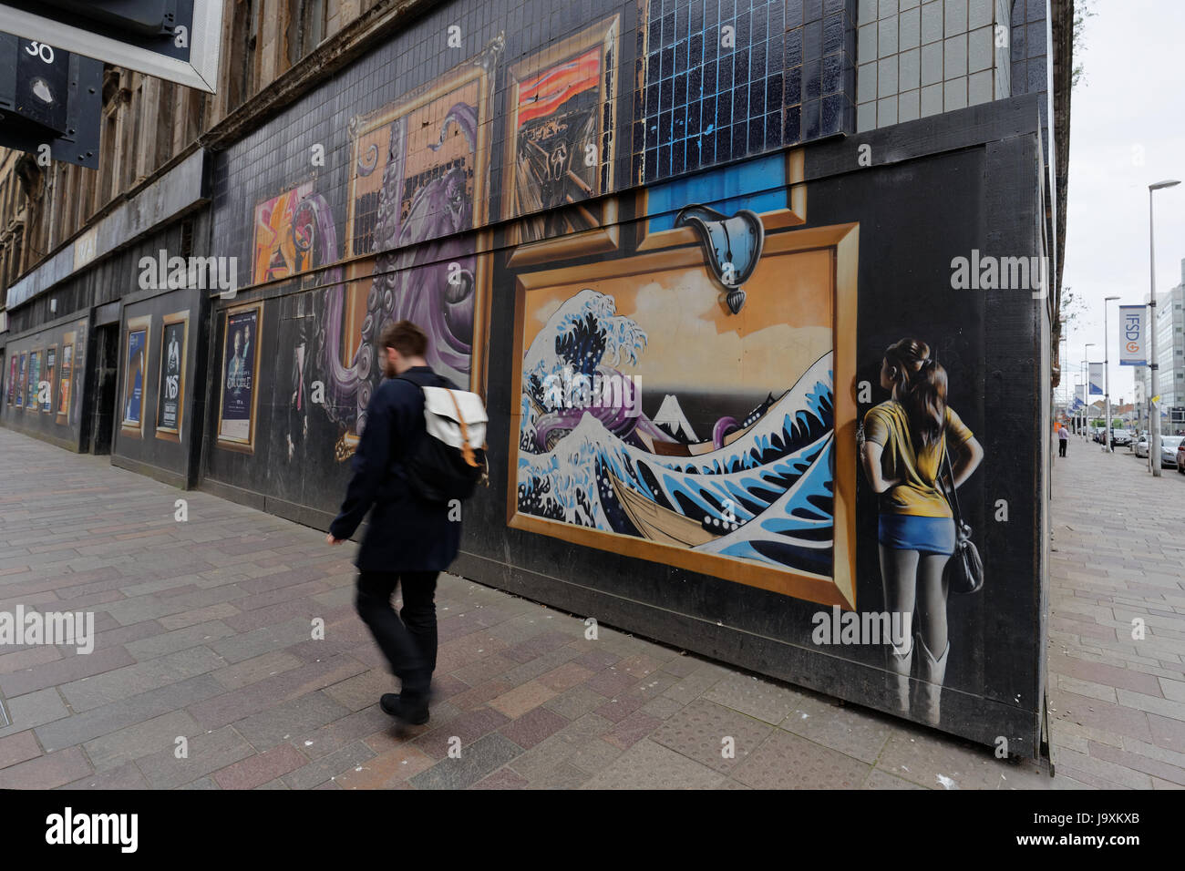 Glasgow public art graffiti commissioned on Argyle street with adverts om site of building to be demolished for new hotel Stock Photo