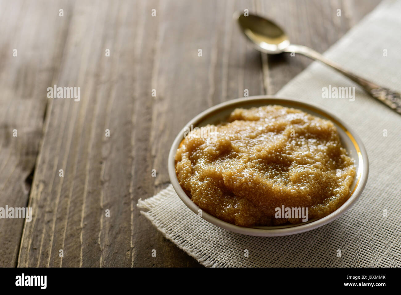 Bowl of amaranth porridge on table, close up view Stock Photo
