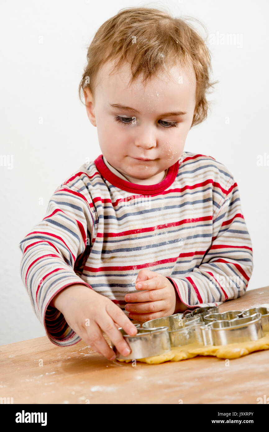 young child making cookies Stock Photo - Alamy