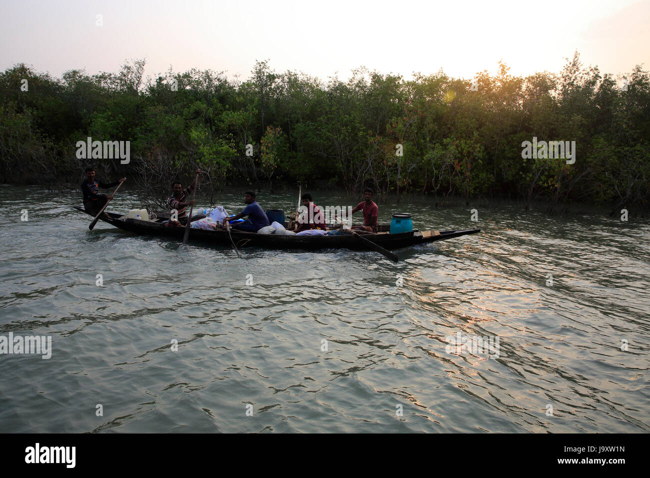 Honey collectors on the way to collect honey in the Sundarbans by boat, a UNESCO World Heritage Site and a wildlife sanctuary. Satkhira, Bangladesh. Stock Photo