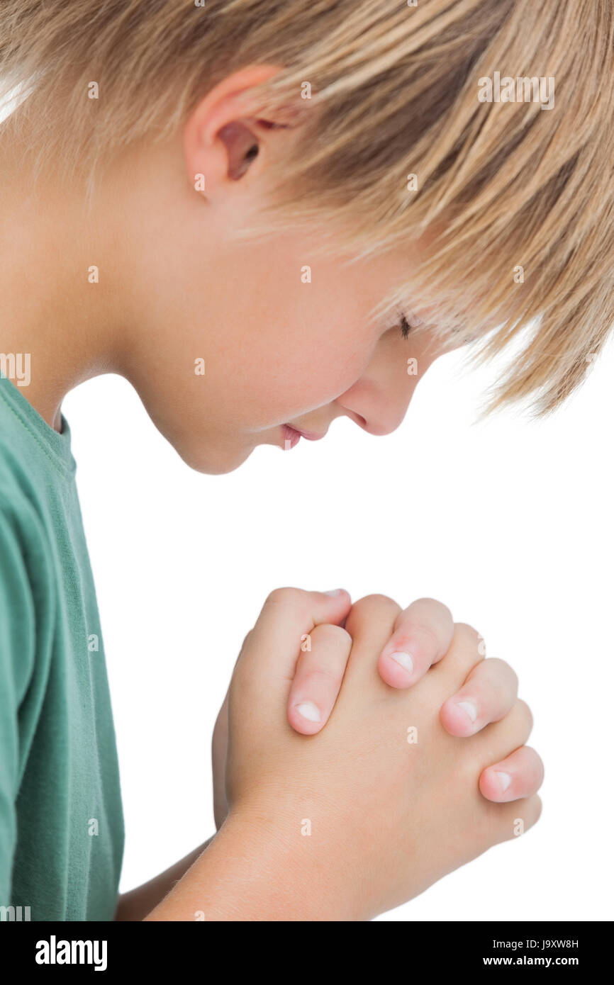 Little Boy Saying His Prayers Side View On White Background Little Boy Saying His Prayers Side View On White Background