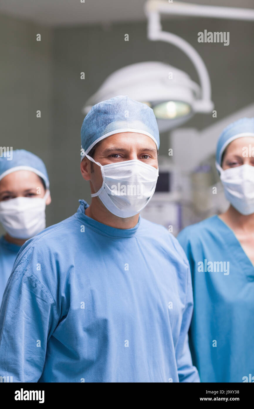 Medical team wearing mask and cap in 