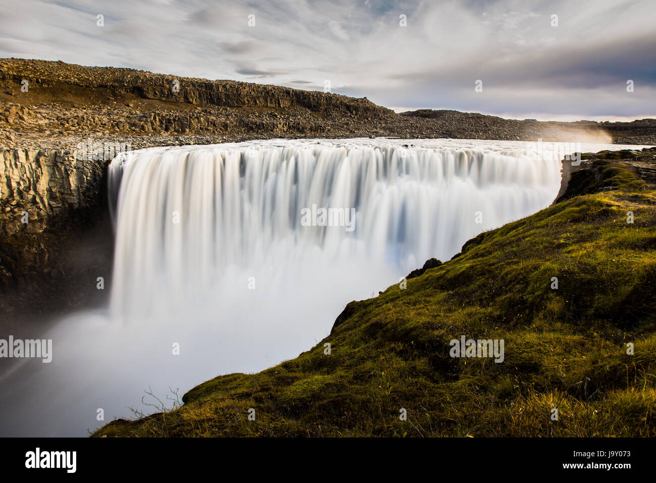 Log exposure of water falling over Dettifoss in Iceland. Stock Photo