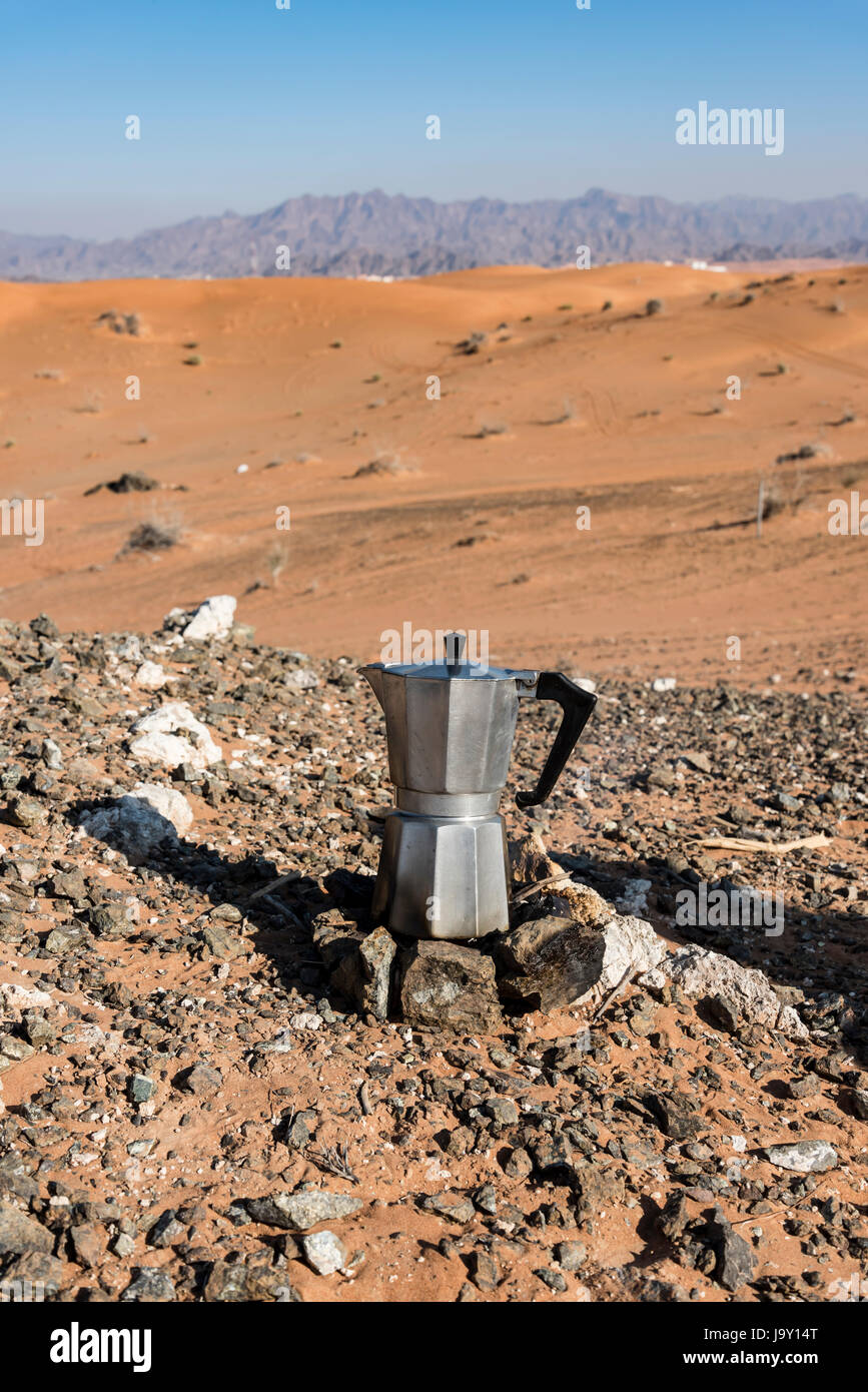 Italian Coffee maker at a fireplace in the desert Stock Photo