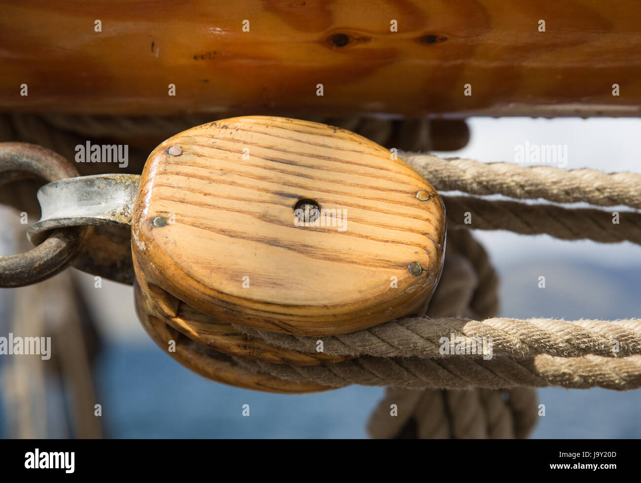 Pulley, block and tackle against blue sky on an old sailing ship off