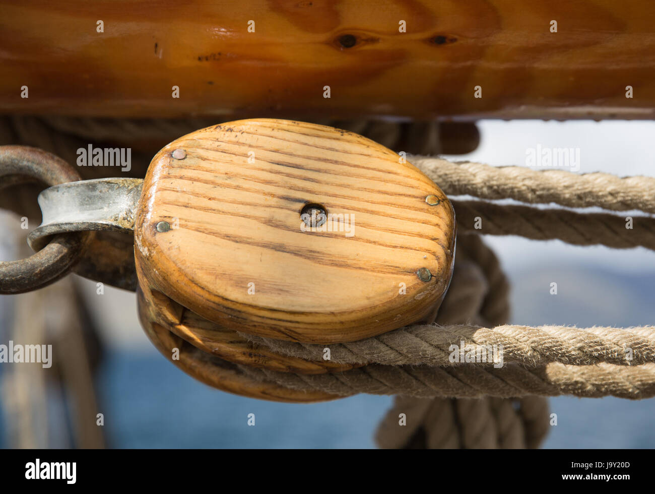 Pulley, block and tackle against blue sky on an old sailing ship off the west coast of Scotland Stock Photo