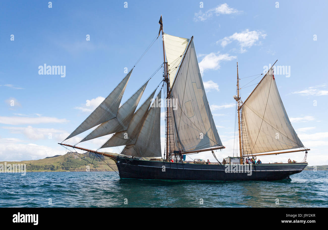 Twin masted sailing ship off the island of Kerrera, Oban, Scotland taken offshore from Gylan Castle Stock Photo