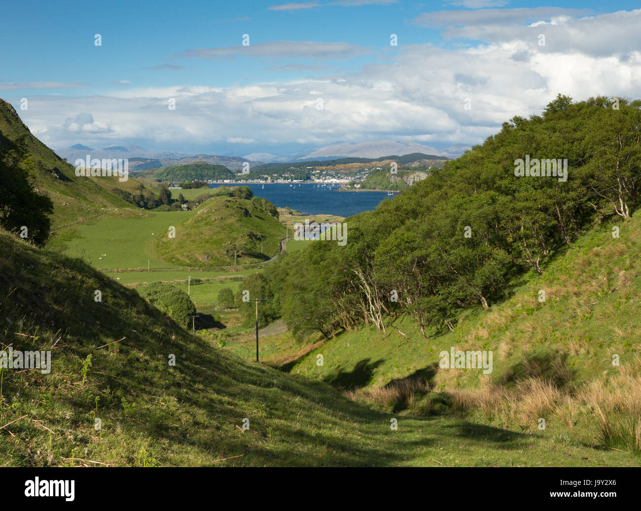 View of Oban across the Sound of Kerrera taken from the island of Kerrera in Scotland Stock Photo
