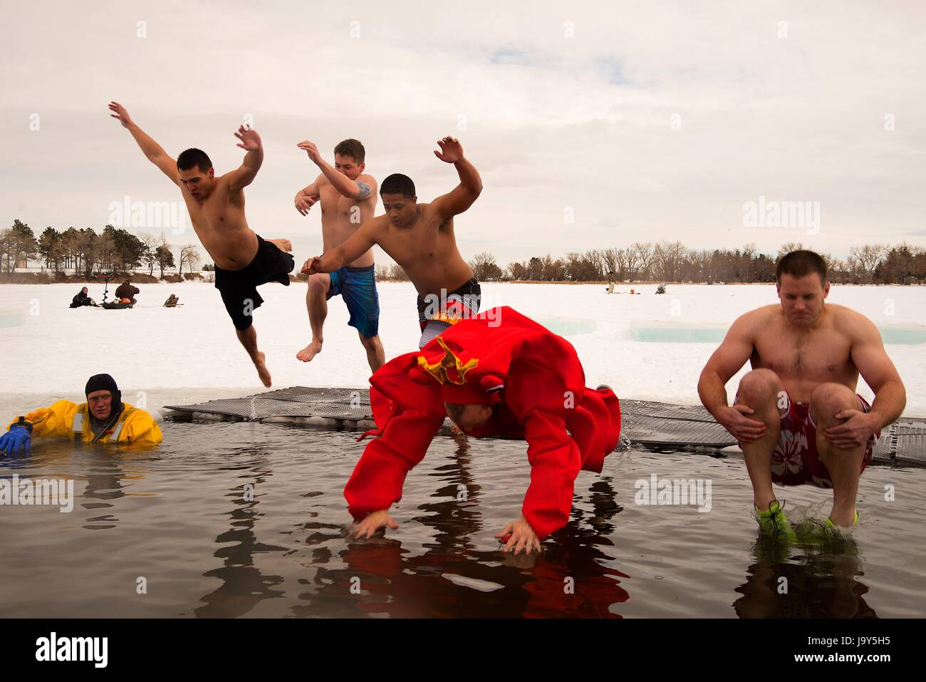 U.S. soldiers jump into icy Sloan Lake during the Matthew S. Schwartz Memorial Polar Plunge charity fundraiser event January 16, 2016 in Cheyenne, Wyoming.    (photo by R.J. Oriez /US Air Force  via Planetpix) Stock Photo