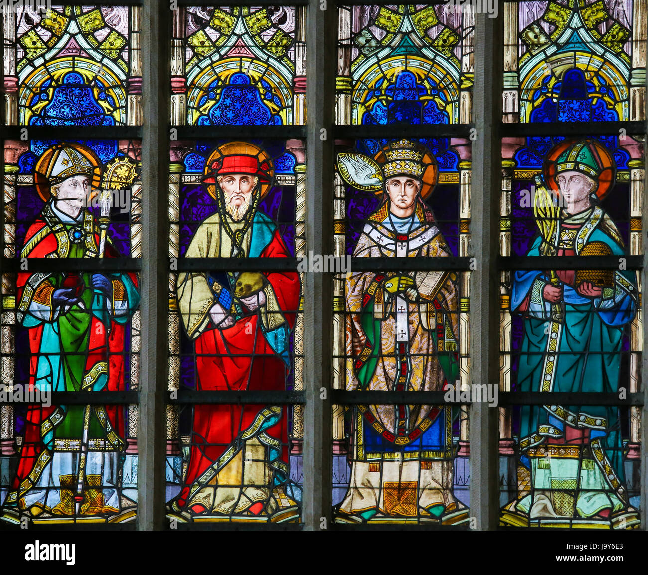 Stained Glass window in St Gummarus Church in Lier, Belgium, depicting Catholic Saints Augustine, Jerome, Gregory and Ambrose Stock Photo