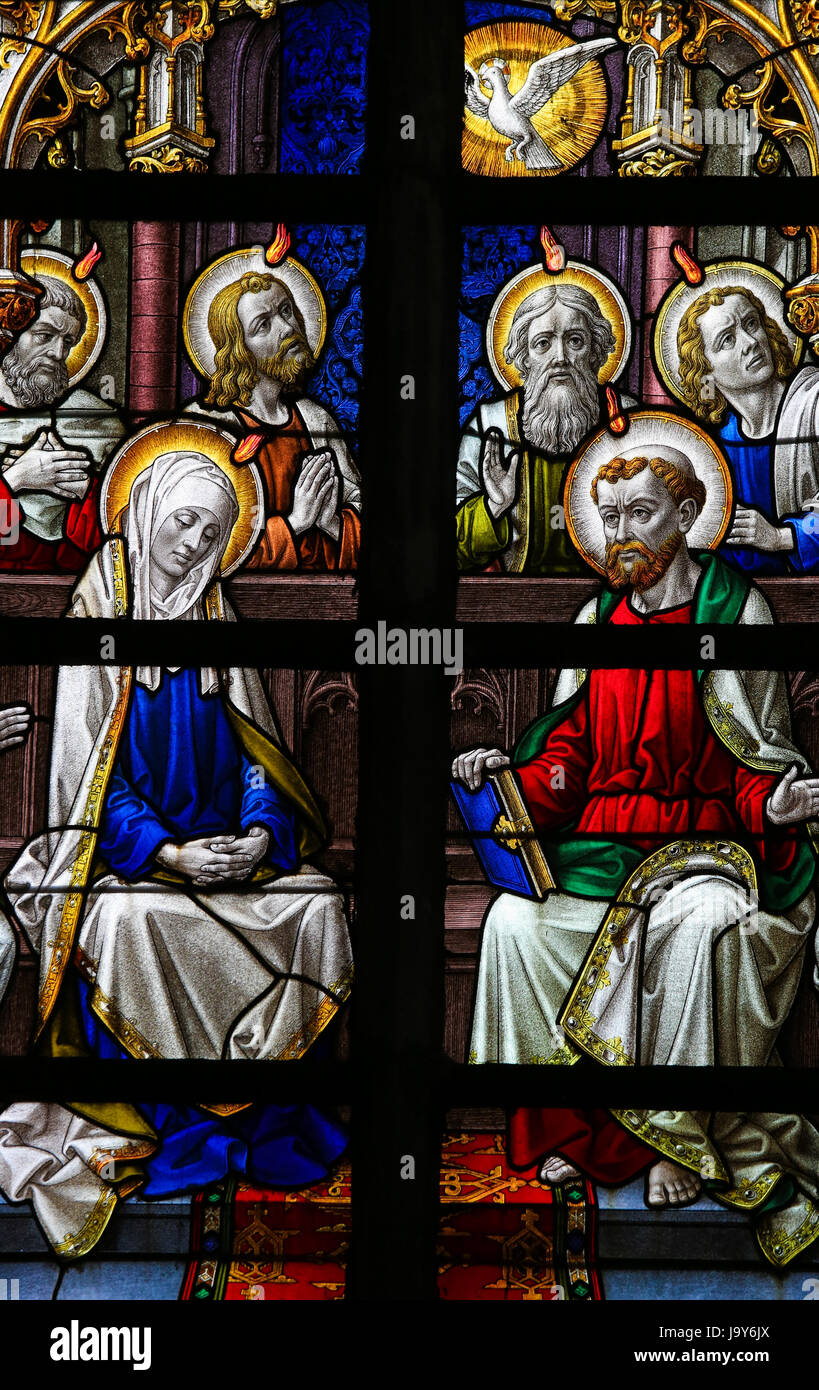 Stained Glass window in St Gummarus Church in Lier, Belgium, depicting Mother Mary and the Apostles at Pentecost Stock Photo
