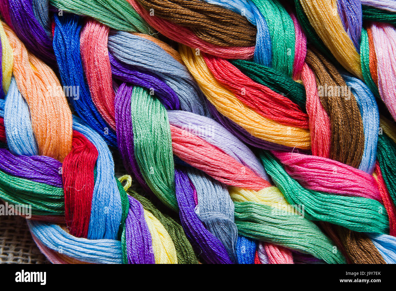 Variable Colored Threads background from varicoloured threads Stock Photo - Alamy