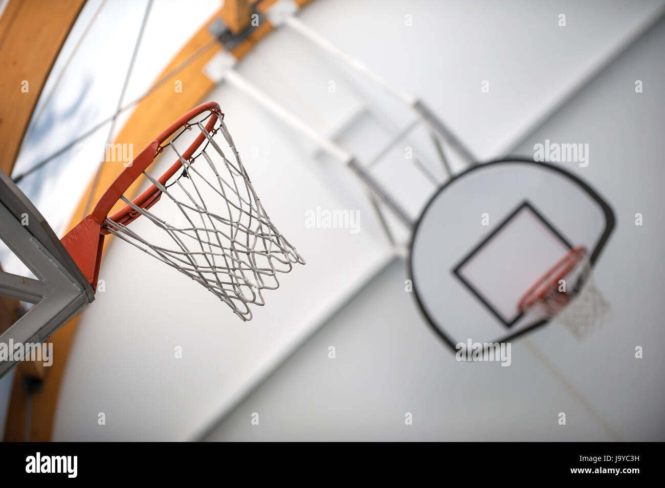 Two basketball hoops in sport school gym hall. Indoor Stock Photo Alamy