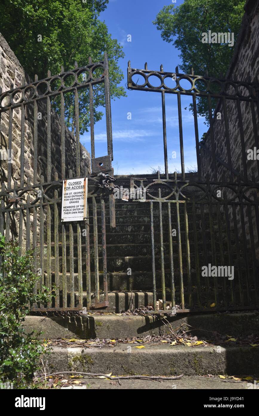 Locked entrance gates at St graveyard in New Mills, High Peak