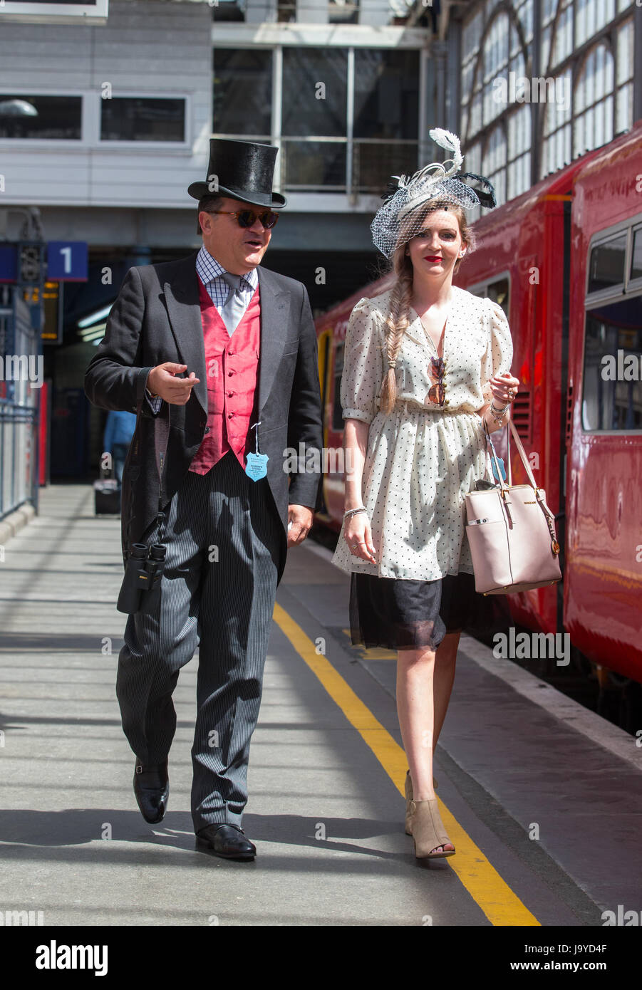 Racegoers at Waterloo, dressed in Top Hat and tails and smart ladies