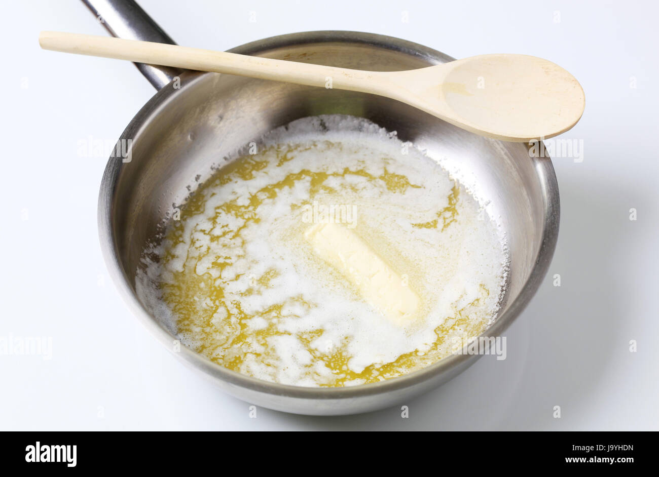 Heating butter in a pan Stock Photo Alamy