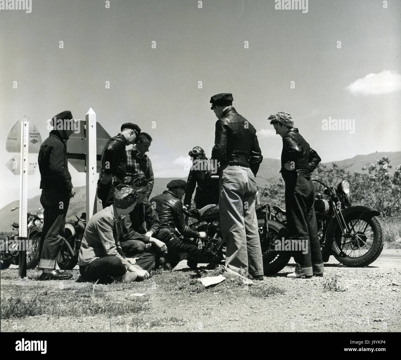 Santa Clara County, California, April 5, 1940 - Roadside Repair - On their way to the motorcycle hill climb, this motorcycle party stopped by the roadside while one of their machines was repaired. Stock Photo