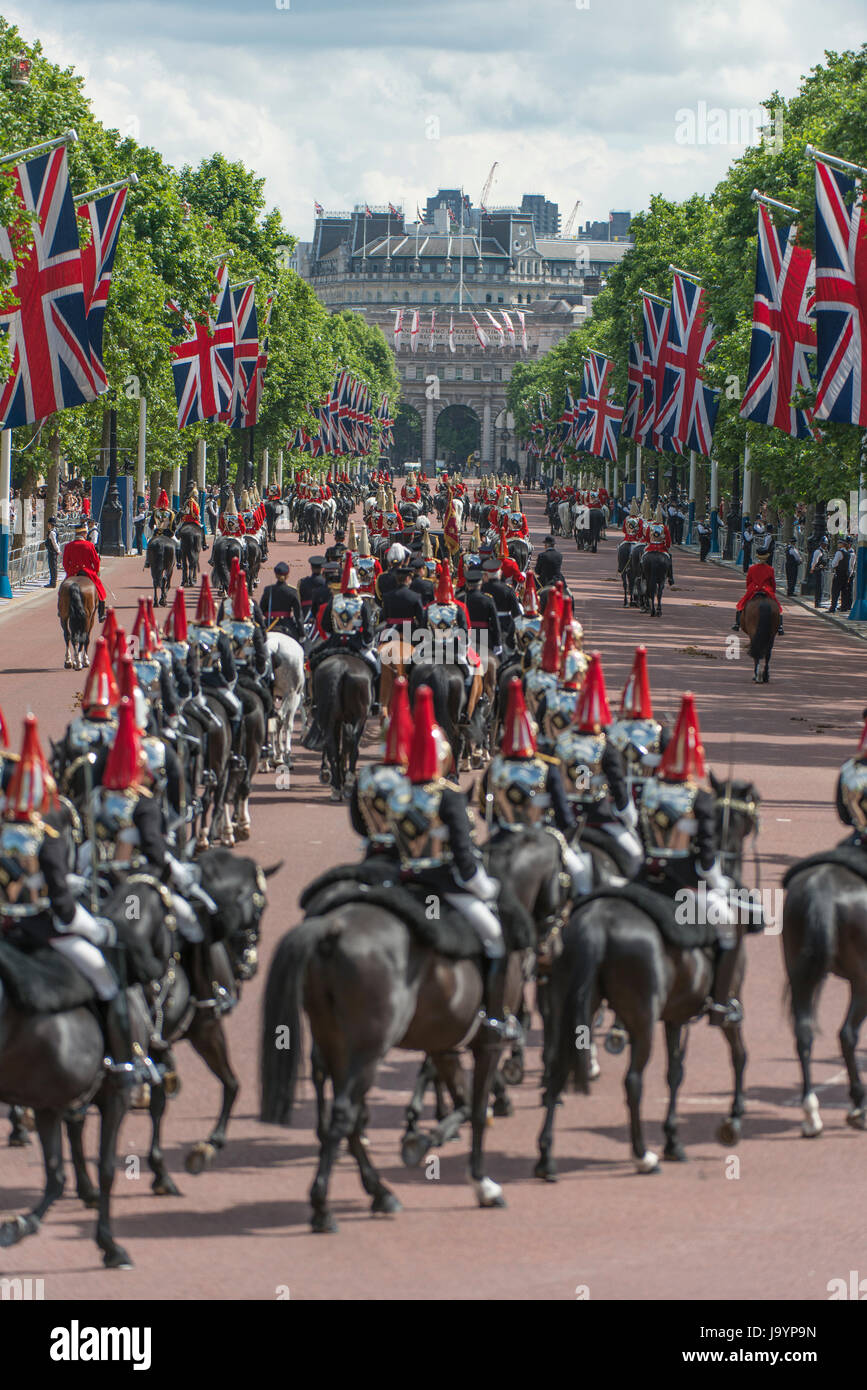 Troops of the Blues and Royals and Life Guards riding down The Mall towards Horse Guards Parade for Major General’s Review rehearsal of QBP Stock Photo