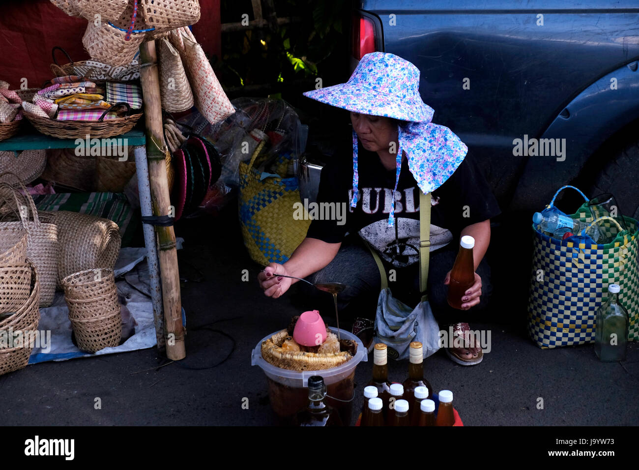 Woman selling street food in Manila capital of the Philippines Stock