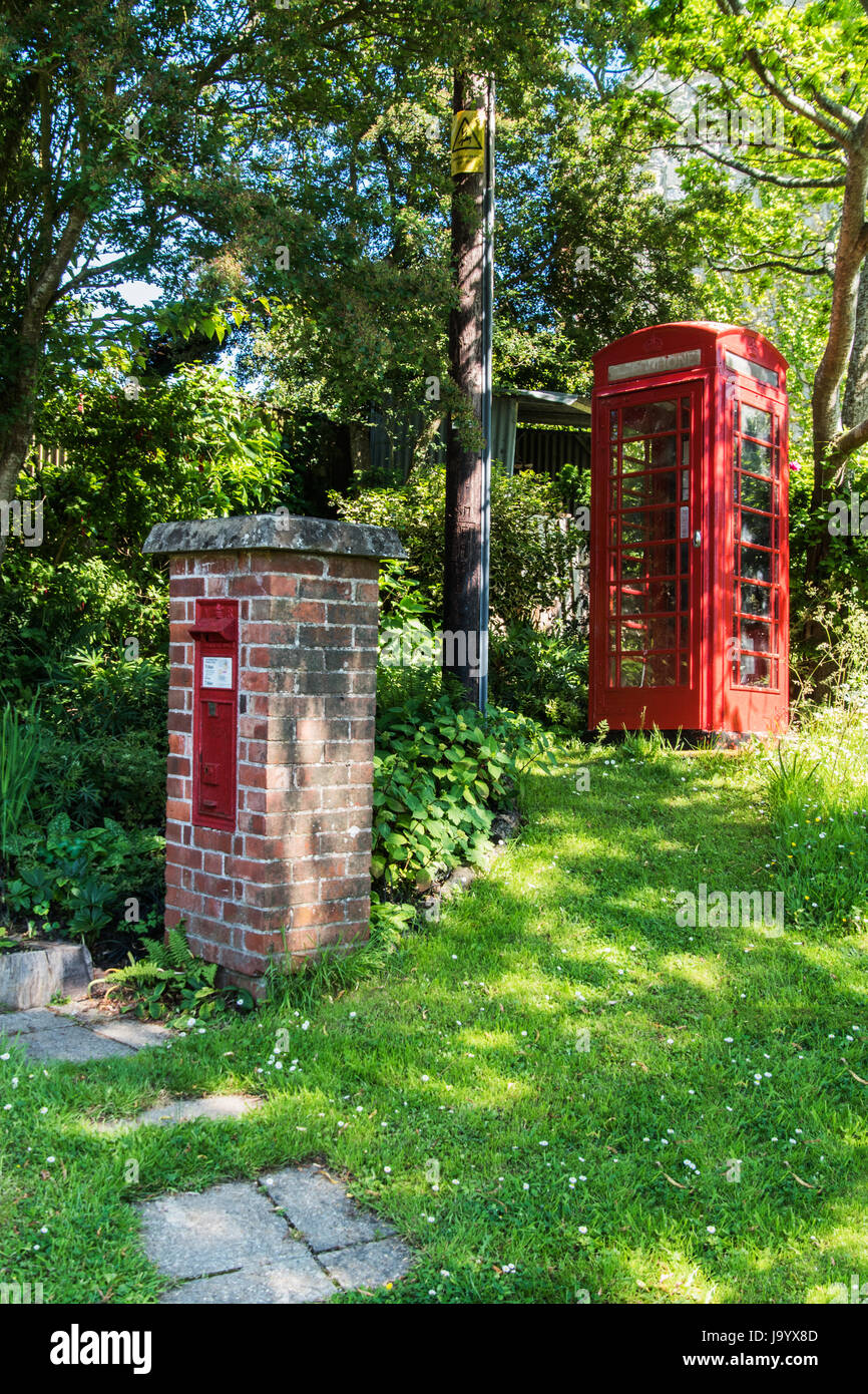 Red telephone box telephone kiosk and pillarbox post box Stock Photo