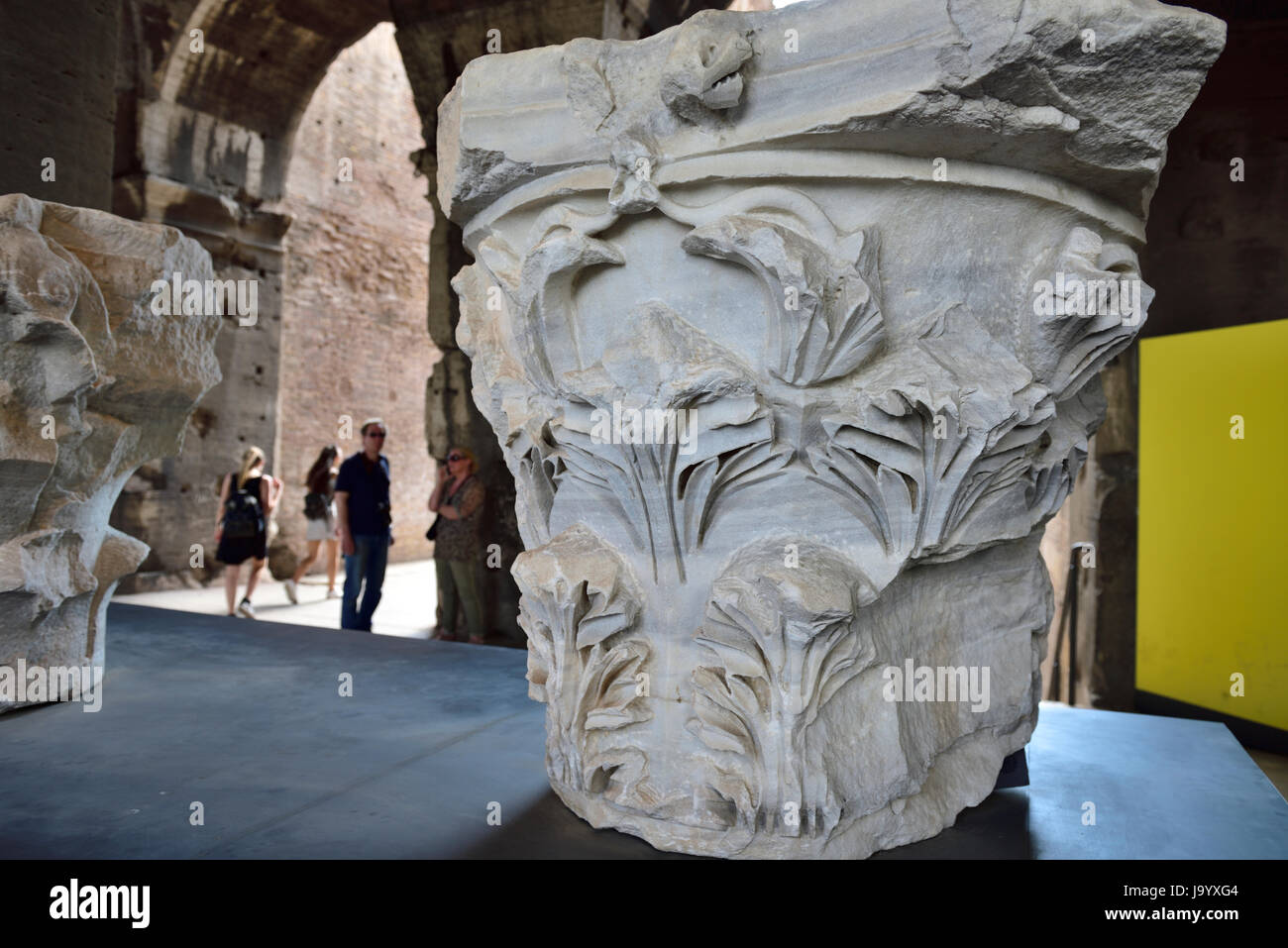 stone capital from the top of a column in display area of the Roman Colosseum, Rome, Italy Stock Photo