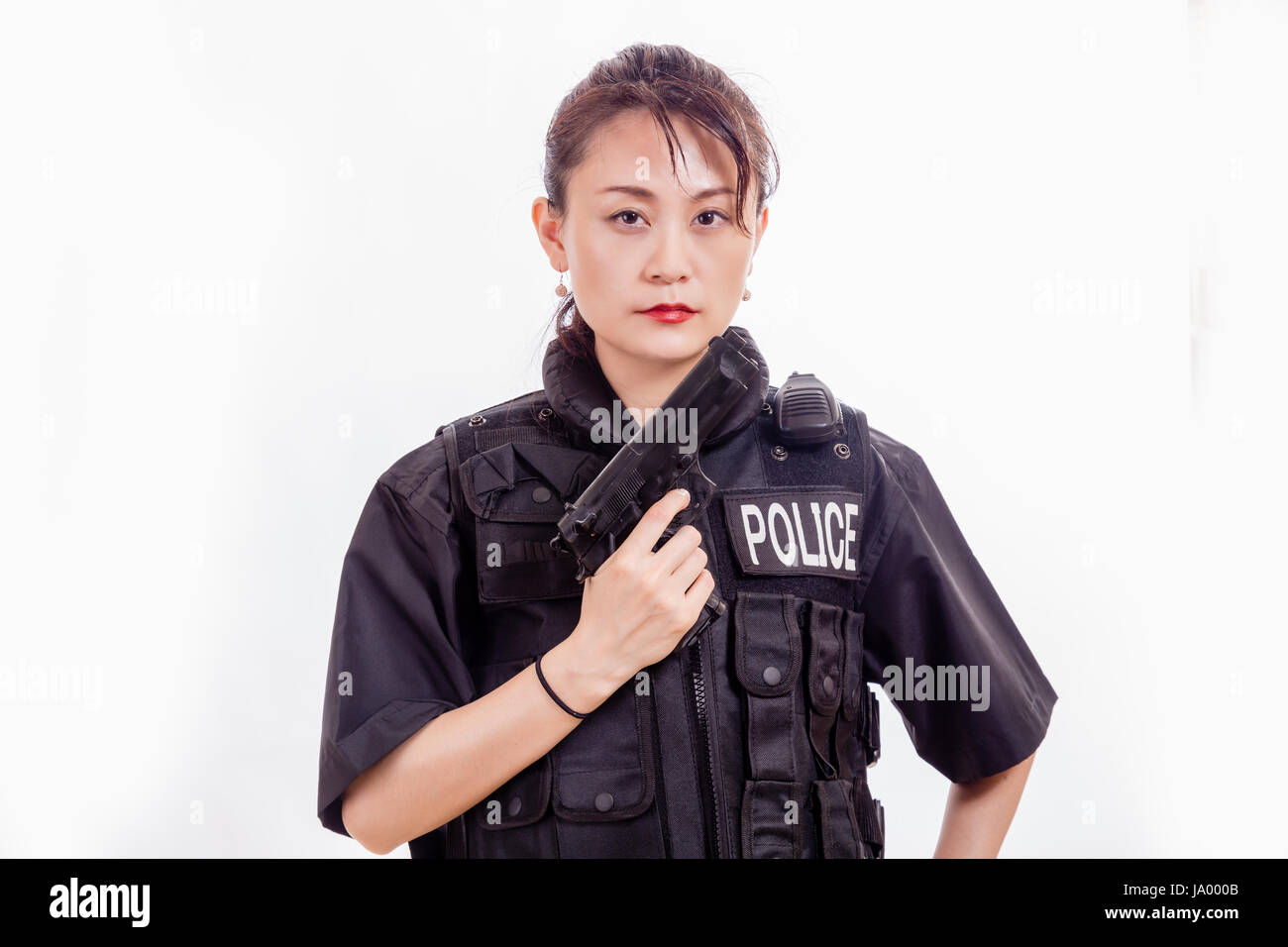 Chinese female police officer with pistol Stock Photo