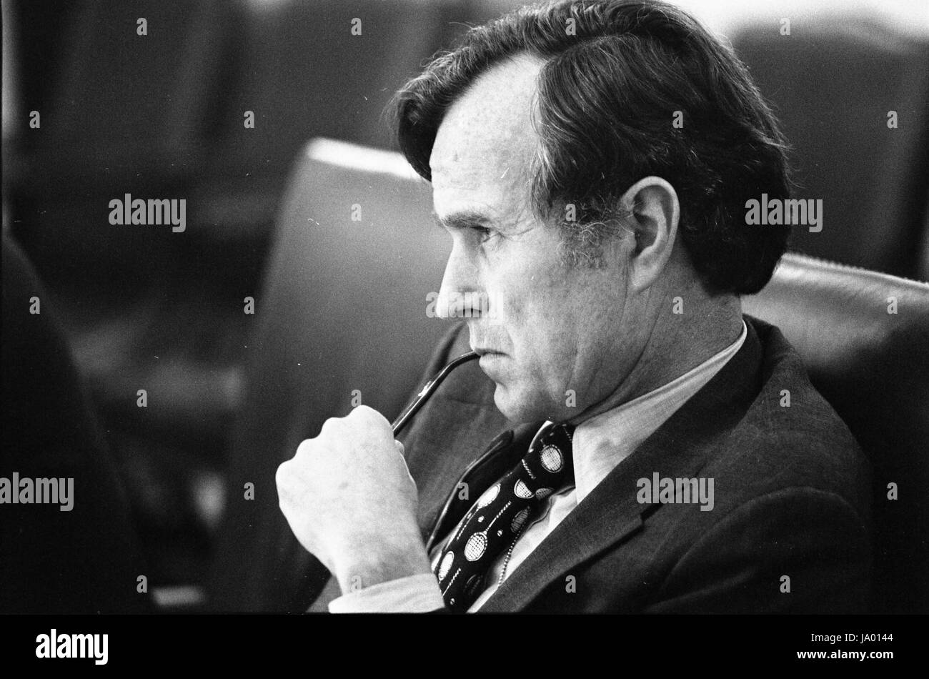 Central Intelligence Agency Director George H. W. Bush listening intently during a meeting to discuss the situation in Lebanon, Washington, DC, 6/17/1976. Stock Photo