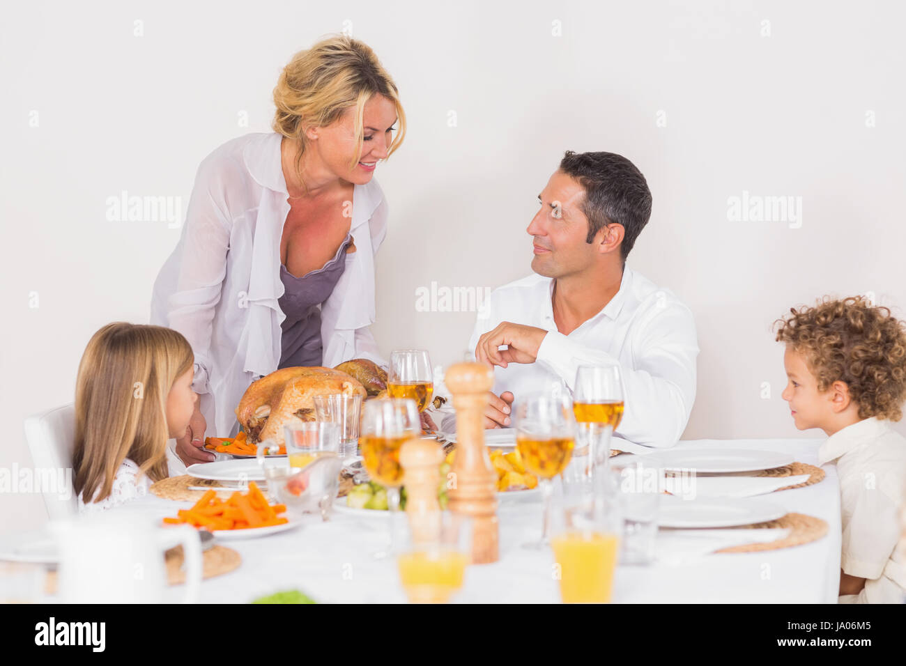Mother serving a turkey for dinner Stock Photo Alamy
